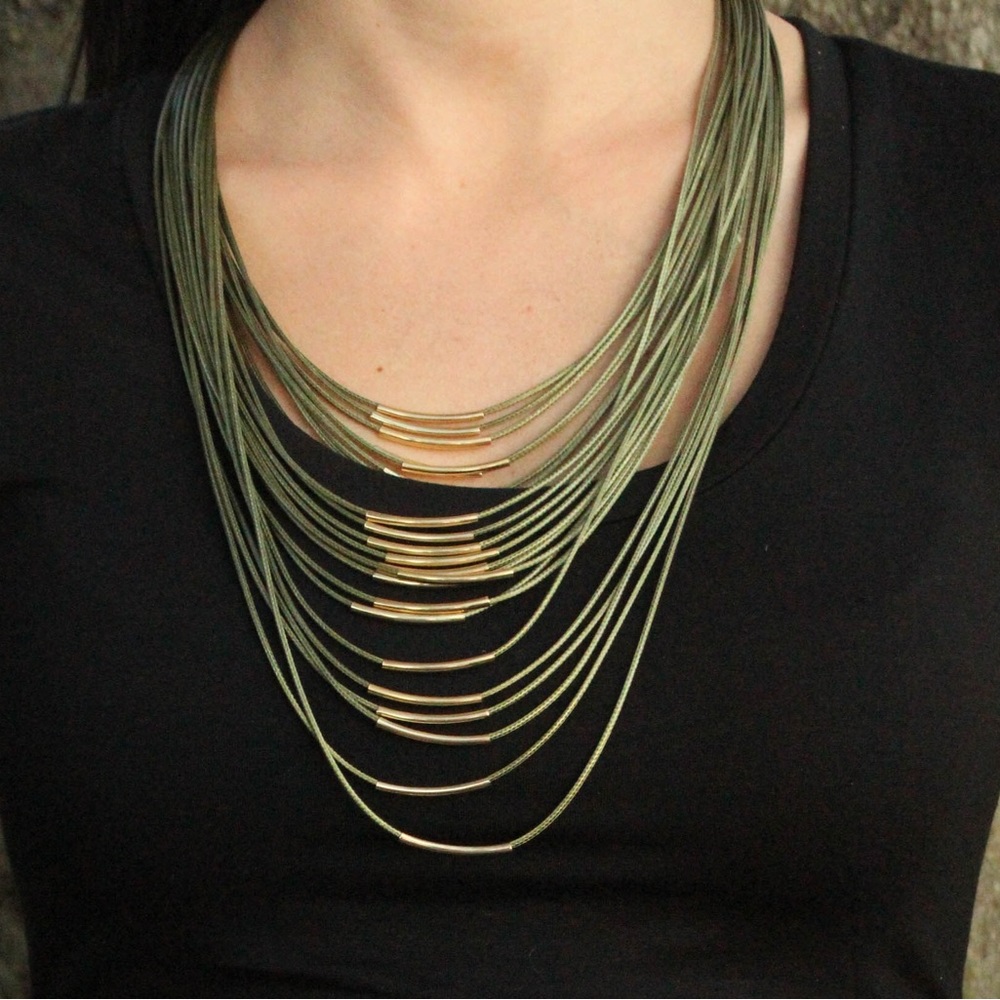 Olive & gold layer necklace. All connected in the back. Worn once.